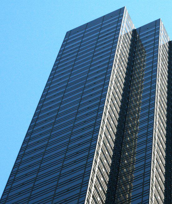 A tall building with two windows on the top of it.